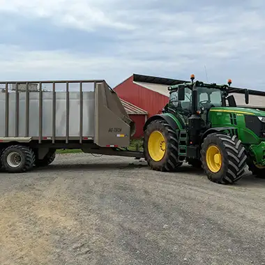John Deere 6205 R with Ag-tech harvest wagon